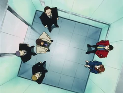 Tokyo Crisis - Lupin, Fujiko, Suzuki and his men in the elevator