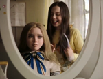 Cady brushing M3GAN's hair.