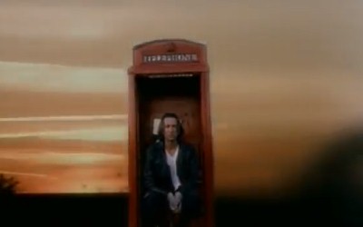 Standing Outside a Broken Phone Booth with Money in My Hand
