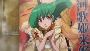 Ranka standing in front a poster of the Galactic Fairy