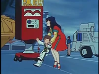 Yoshio demands Minmay to buy him a can of Petite Cola.