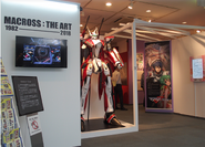 Fans are greeted by the new YF-29 Durandal statue by the entrance to the exhibit.