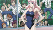 Sheryl arriving at the pool in her swimsuit with many perverted male students staring behind the fence