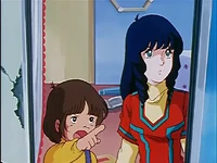 Yoshio pointing at Hikaru Ichijyo's Valkyrie.