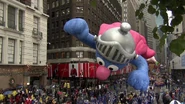 Super Grover braves through the heavy rain in his final appearance during the 2006 parade NBC Telecast