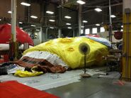 The second SpongeBob SquarePants balloon & The Elf on the Shelf are dried out by fans after a grey (But still colorful) and wet 2014 Parade.