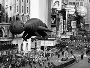 Happy Dragon leads Elsie the Cow down the parade route in 1963