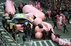 The battered remains of the Pink Panther balloon were quickly sidelined by NYPD officers and balloon handlers