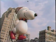 Skater Snoopy flies down Herald Square on the 1987 NBC Telecast