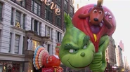 The Grinch escorts Santa Claus during the 2018 parade NBC telecast