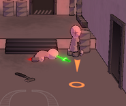 The player about to retrieve a melee weapon that was thrown into an enemy's head.