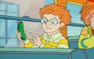 Arnold holding a pickle.