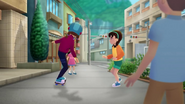 Annie passing by the townsfolk.