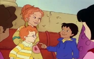 Ms. Frizzle and Carlos looking at each other. Annoyed Arnold