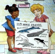Molly with Shirley holding a whale diagram
