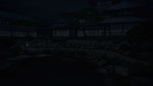 Yotsuba Main House frontage at night.