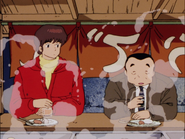 Godai and Mr. Ichinose eating on a stand on the street