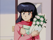 Kyōko comes to visit Godai and Mitaka with flowers