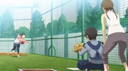 Izumi teaching Mutsuko how to throw a slider