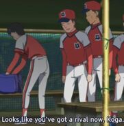 A teammate tells Koga to watch the 5th grader try-out.