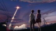 Takaki and Kanae with the rocket
