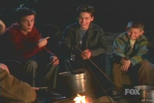 the boys are at the campfire