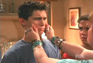 Gretchen giving Reese on his cheeks