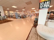 Upper-level furniture and housewares section, by the second-level mall entrance.