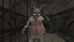 The White Rabbit waving to the camera.