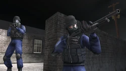 SWAT officers searching for Daniel Lamb at the Wooddale Community Enclave with Shotguns.