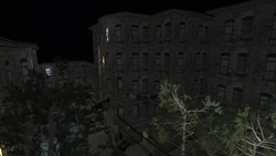 Rear view of the apartment building in which the deli is located.