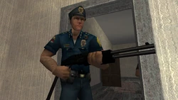 A CCPD officer armed with a Shotgun.