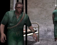 A hanged inmate in the background.