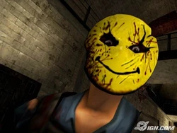 A Medium Smiley staring at the camera directing up, on the bottom cell blocks.