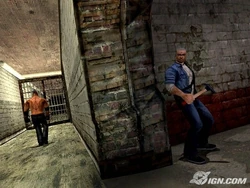 Cash hiding in one of the shadows holding a Hammer, with a Big Smiley walking to the other way, on the bottom cell blocks.