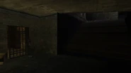 The entrance door of the cellar locked with a padlock.