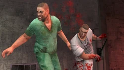 An Asylum Staff member knocking down an inmate.