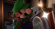 Luigi obtaining E. Gadd's briefcase after defeating Chambrea.
