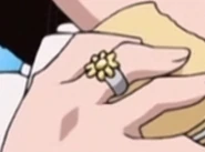 Ring on Emokis' right hand.