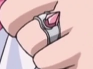Ring on Emokis' left hand.