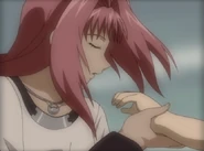 Diana gently blows across Dorothy's hand as a charm.