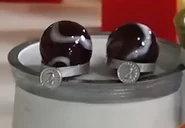 Orbit, the captain of the Purple Rockets, on the podium with Sulfur in Domino Bowling (2022).