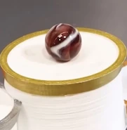 Saucer on the podium after Event 8 of Marble Survival 100.