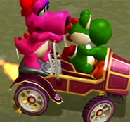 Yoshi und Birdo im Herzchen-Mobil
