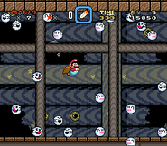 Mario swimming between several Disappearing Boo Buddies in Super Mario World