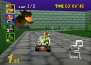  approaching a Bowser Statue in his courtyard.