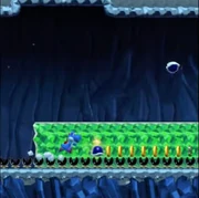 Yoshi walks along the Munchers.