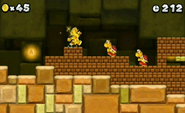 An early screenshot displaying the new Gold Mario power-up.