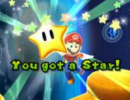 Mario consiguiendo una estrella de poder en Super Mario Galaxy