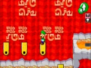 Luigi hops across the Donut Lifts.